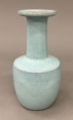 A Chinese Jun Ware type pale blue glazed vase. 16.5 cm high.