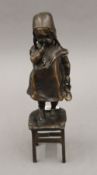 After JUAN CLARA (1875-1958) Spanish, Girl on a Stool Holding a Shoe, patinated bronze. 28 cm high.