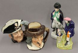 Two Royal Doulton character jugs together with two Staffordshire figures. The largest 28 cm high.