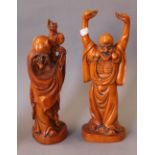 A pair of Chinese carved wooden figures. The largest 36 cm high.