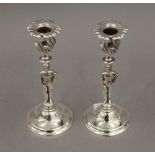 A pair of silver plated candlesticks formed as jockeys. 19.5 cm high.