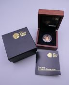 A 2013 proof half sovereign, boxed and with certificate.