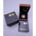 A 2013 proof half sovereign, boxed and with certificate.