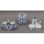 A blue and white porcelain cruet stand, a double egg cup stand and a lidded jar.