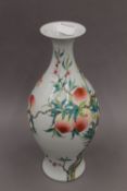 A Chinese peach decorated porcelain vase. 35 cm high.