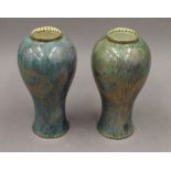 A pair of Wedgwood dragon lustre vases. 23.5 cm high.