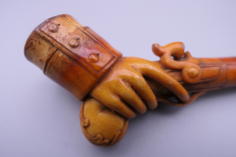 A cased 19th century meerschaum and amber pipe formed as a hand holding a pistol. 12 cm long. - Image 4 of 13