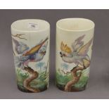 A pair of porcelain vases decorated with parrots. 24.5 cm high.