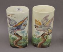 A pair of porcelain vases decorated with parrots. 24.5 cm high.