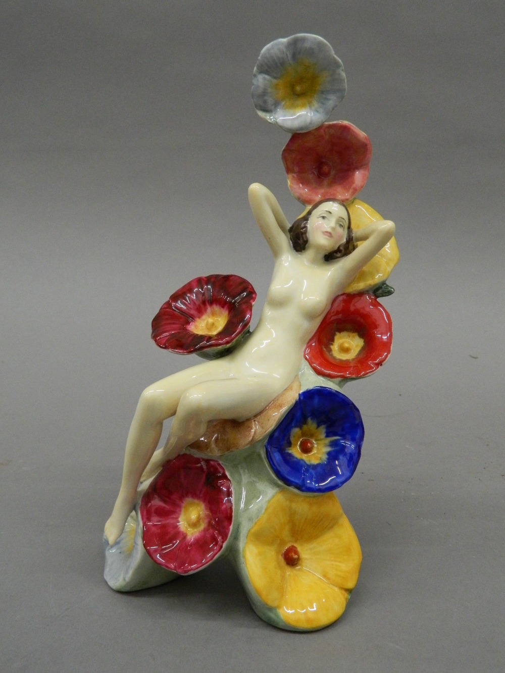 A Carlton Ware figurine, The Carlton Girl ''Hollyhocks''. 22 cm high.