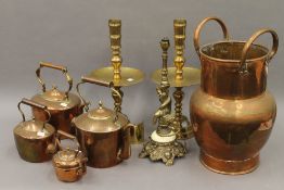 A quantity of various brass and copper ware, including kettles, candlesticks, etc.