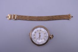 A gold filled pocket watch with optional strap. 4 cm wide.