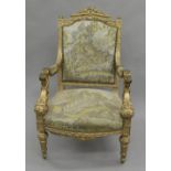 A tapestry covered 19th century carved gilt wood open armchair. 67.5 cm wide.