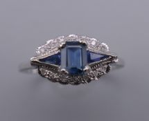 An Art Deco style 9 ct white gold sapphire and diamond ring. Ring size N/O.