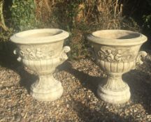 A pair of garden urns. 68 cm high x 56 cm diameter.