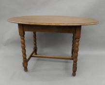 An early 20th century oak barley twist table and five chairs. The table 134 cm long.