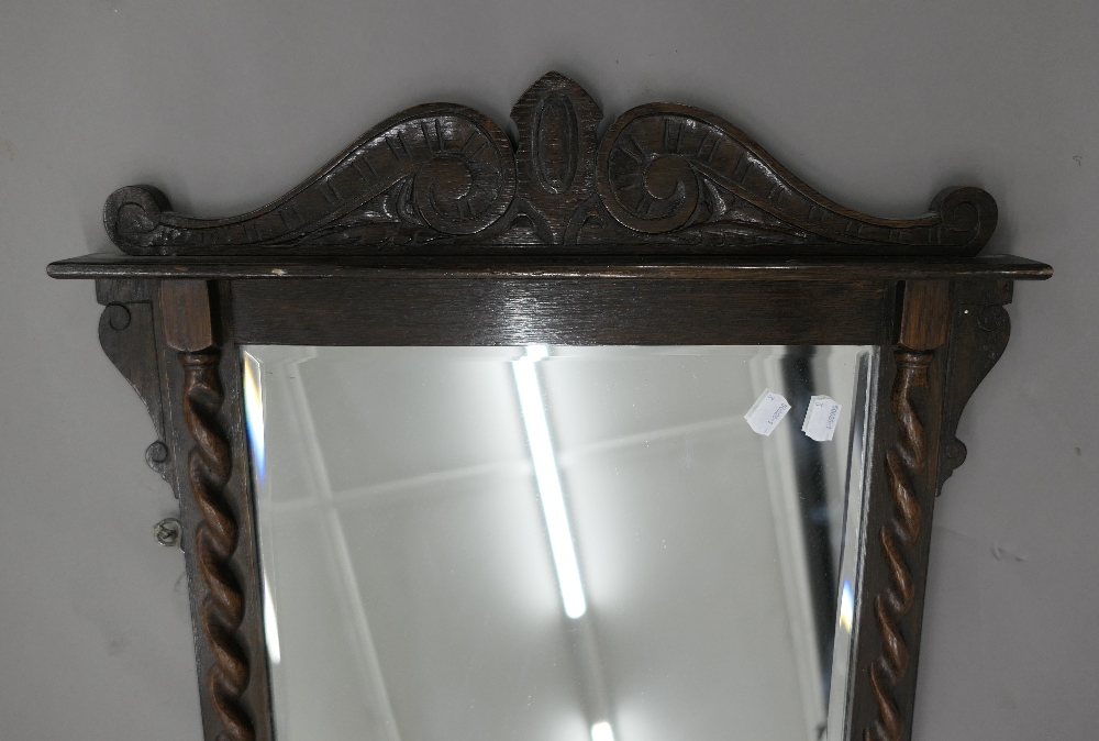 An early 20th century oak barley twist wall glass/mirror. 85 cm high. - Image 2 of 2
