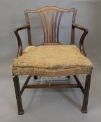 A Georgian mahogany open armchair, the underside initialled HK. 60 cm wide.