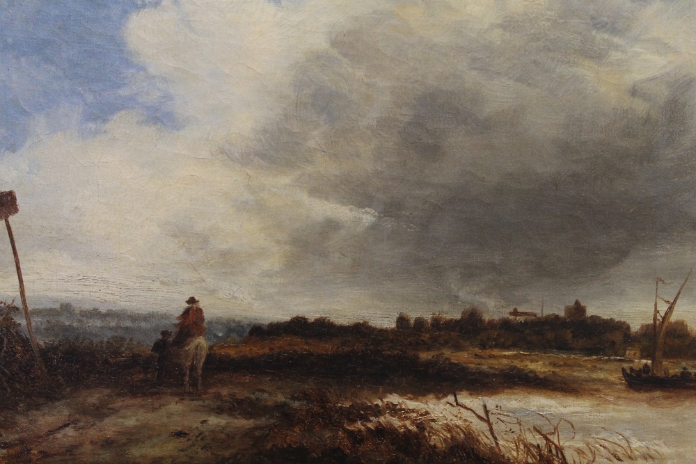 A 19th century oil on canvas, Travellers on a Path before a Village, framed. 29.5 x 22 cm.