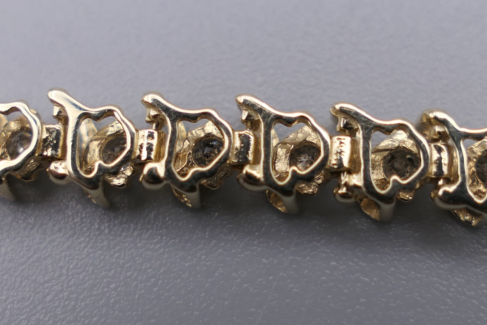 A 14 K gold diamond tennis bracelet with forty-seven diamonds, 0. - Image 8 of 9