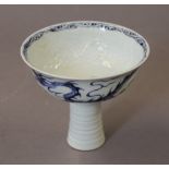 A Chinese blue and white porcelain stem cup. 10 cm high.