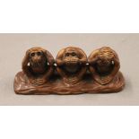 A Japanese model of the three wise monkeys. 11 cm long, 3.5 cm deep, 4.5 cm high.