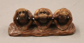 A Japanese model of the three wise monkeys. 11 cm long, 3.5 cm deep, 4.5 cm high.