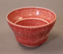 A small Chinese red porcelain bowl. 9.5 cm diameter.