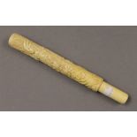 A bone carved cigar holder. 23 cm long.