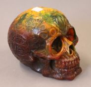 A model of a skull. 12.5 cm high.