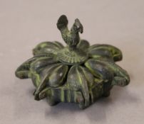 An Indian bronze spice box. 7 cm diameter.