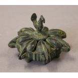 An Indian bronze spice box. 7 cm diameter.