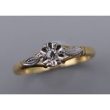 An 18 ct gold illusion set diamond solitaire ring. Ring size P.