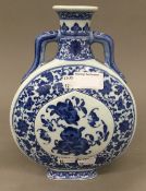 A Chinese porcelain blue and white moon flask. 24 cm high.