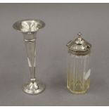 A silver bud vase and a silver topped glass jar. The former 15 cm high.