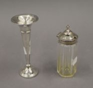 A silver bud vase and a silver topped glass jar. The former 15 cm high.
