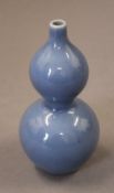 A small Chinese double gourd blue porcelain vase. 11.5 cm high.