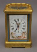A French gilt cased repeating carriage clock set with Sevres style porcelain panels. 17 cm high.