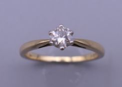 An 18 ct gold diamond solitaire ring, with EGL Report card stating diamond weight 0.