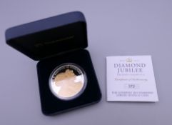 A boxed Guernsey 2012 Diamond Jubilee silver 5 pound coin.