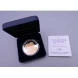 A boxed Guernsey 2012 Diamond Jubilee silver 5 pound coin.