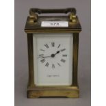 A Mappin and Webb carriage clock. 11 cm high excluding handle.