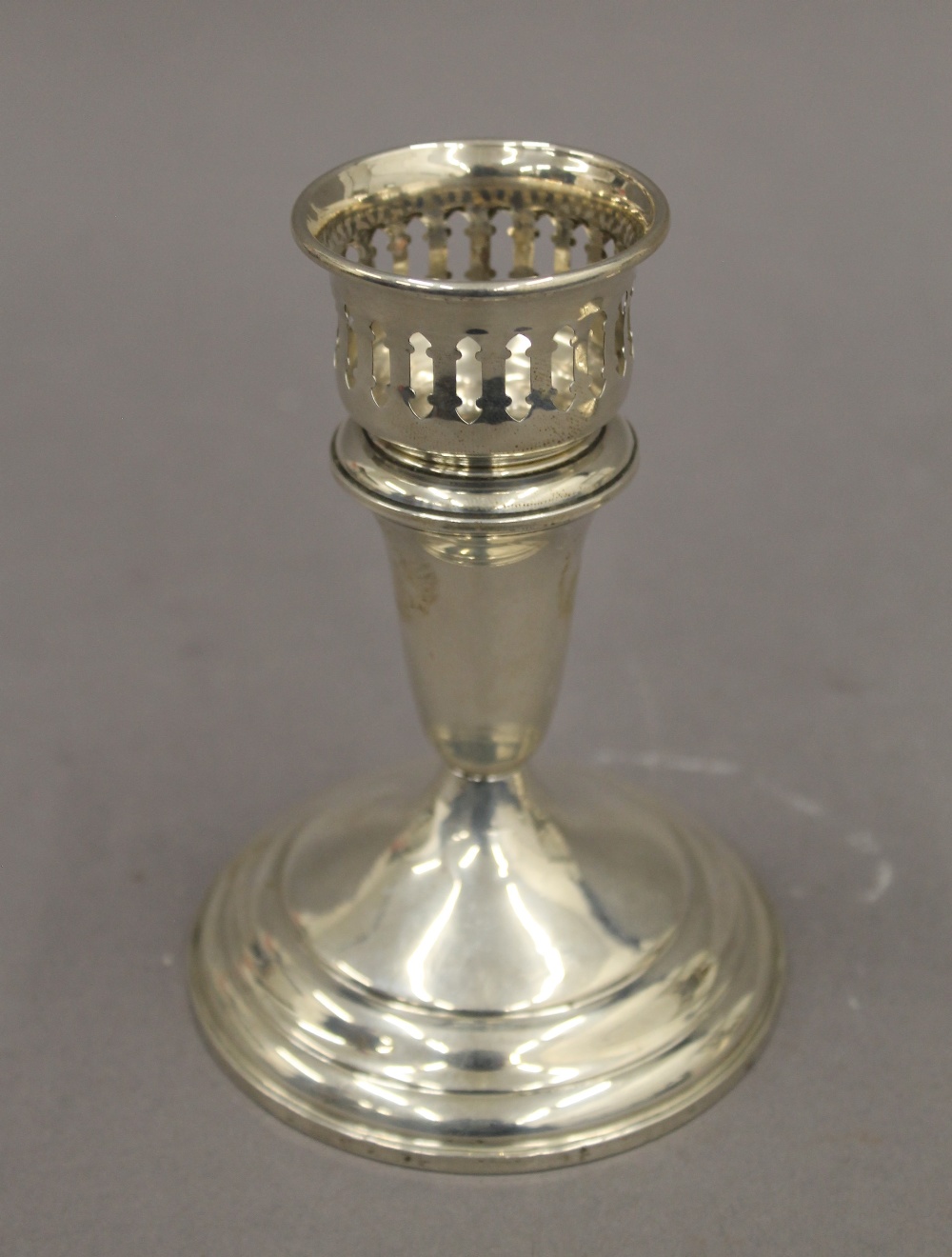 A pair of sterling silver candlesticks with detachable sconces. 13 cm high. 23.4 troy ounces loaded. - Image 2 of 4