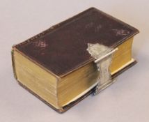 A 19th century Dutch New Testament with silver clasp. 13 cm high.