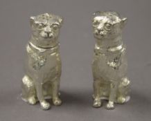 A pair of silver plated bulldog salt and pepper. 6 cm high.