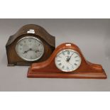 An early 20th century oak mantle clock and another mantle clock. The former 21 cm high.