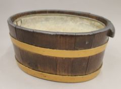 A coopered oak wine cooler. 35 cm wide.