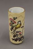 A cylindrical porcelain vase decorated with a Blue Tit. 18 cm high.