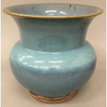 A Chinese Jun Ware type blue glazed vase. 20.5 cm high x 21 cm diameter.