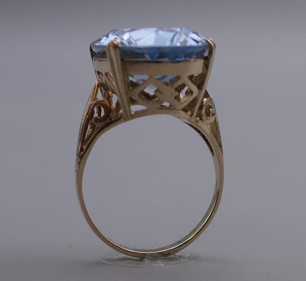 A 9 ct gold ring set with a large light blue aquamarine. Ring size P/Q. 7.2 grammes total weight. - Image 2 of 8